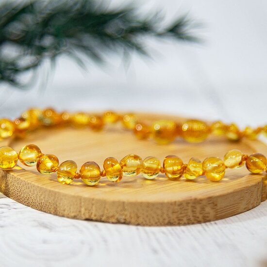 Collier Ambre bébé   Honey        de               Irréversible