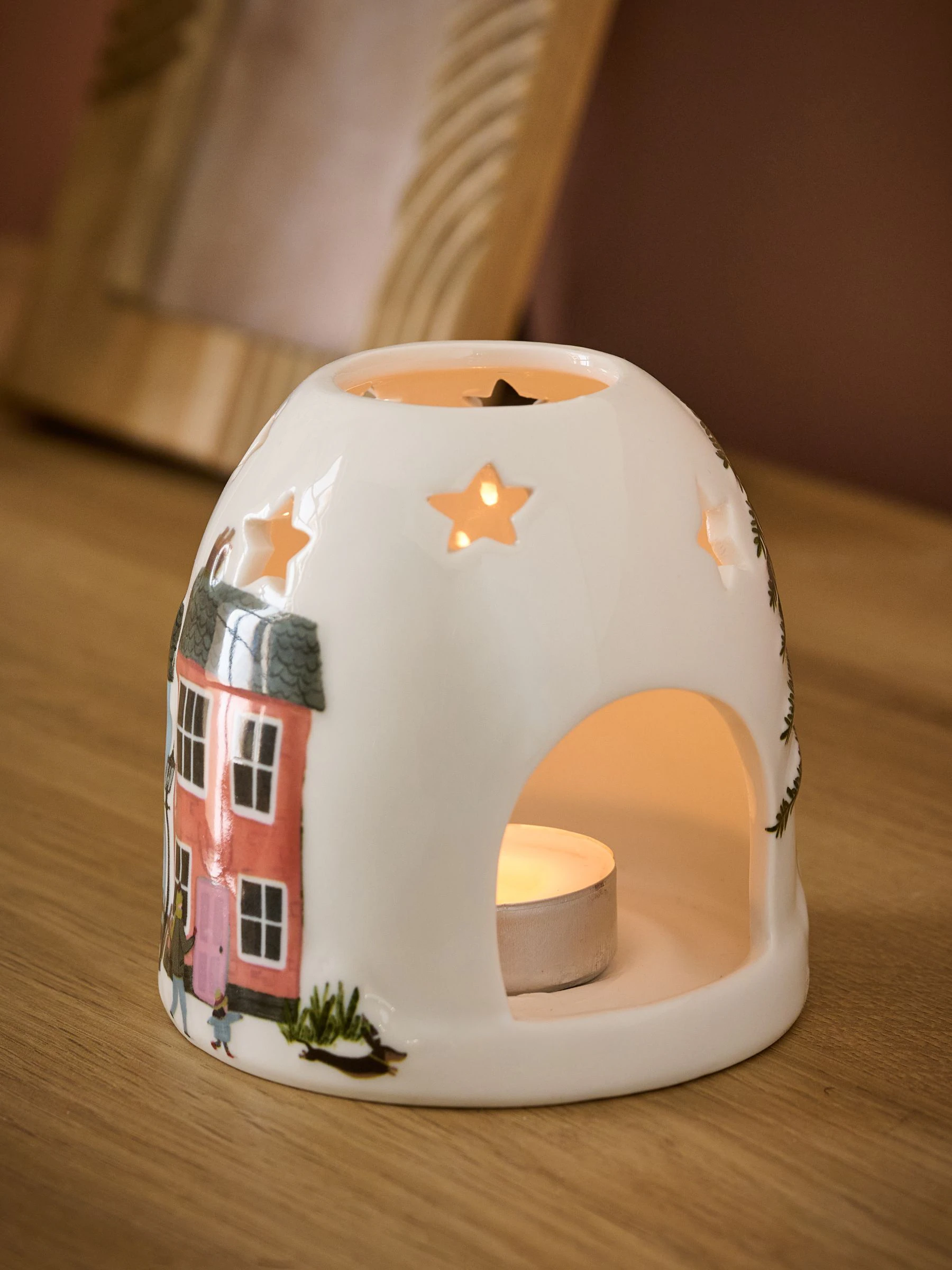Theelichthouder met keramische huisjes