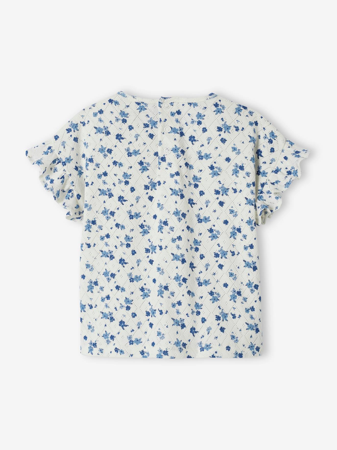 Camiseta infantil de malha aberta com estampa floral.