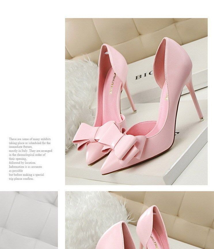 Niuna - Puntige stiletto's met strikaccent
