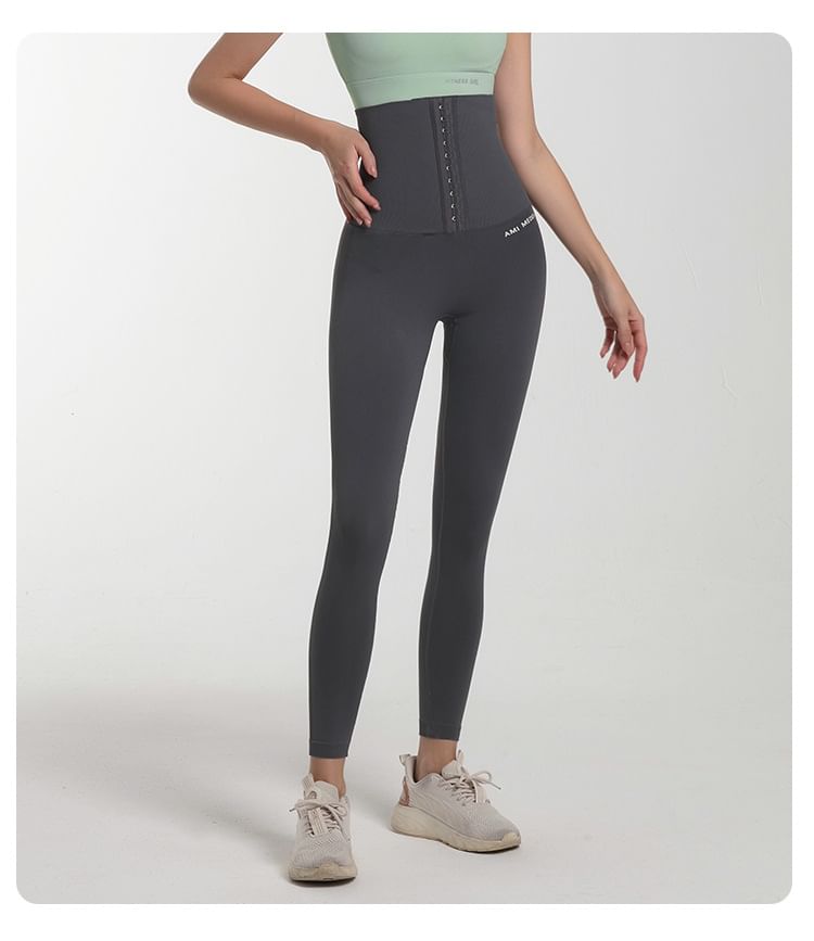 Sishan - Sportlegging met taillevormende letters