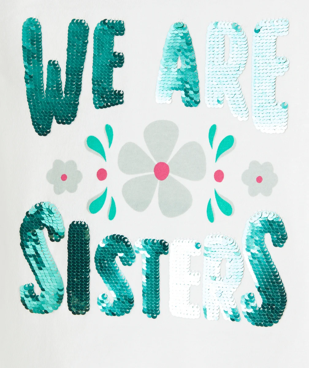 T-SHIRT FILLE EN COTON BIO BLANC AVEC MESSAGE SISTERS EN SEQUINS VERTS