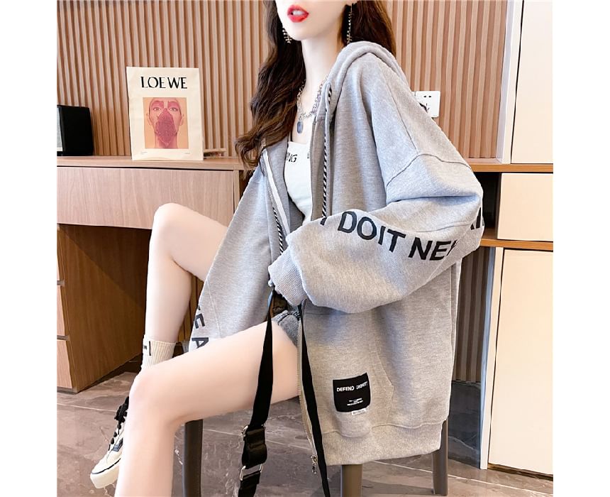 Carotaine - Oversized hoodie met rits en letters