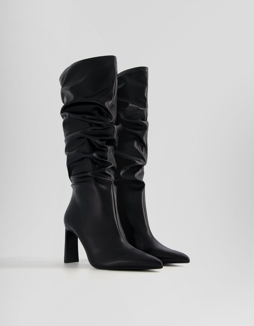 Botas de salto agulha folgadas