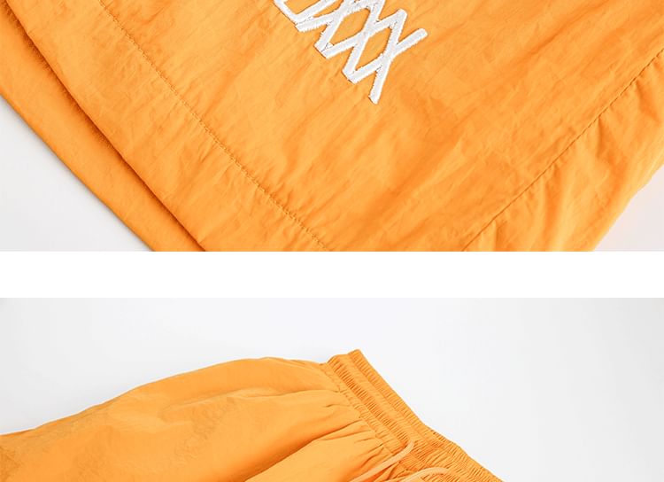 Hushgrain - Wijde shorts met hoge taille en letters