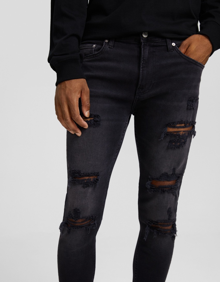 calça jeans super skinny rasgada