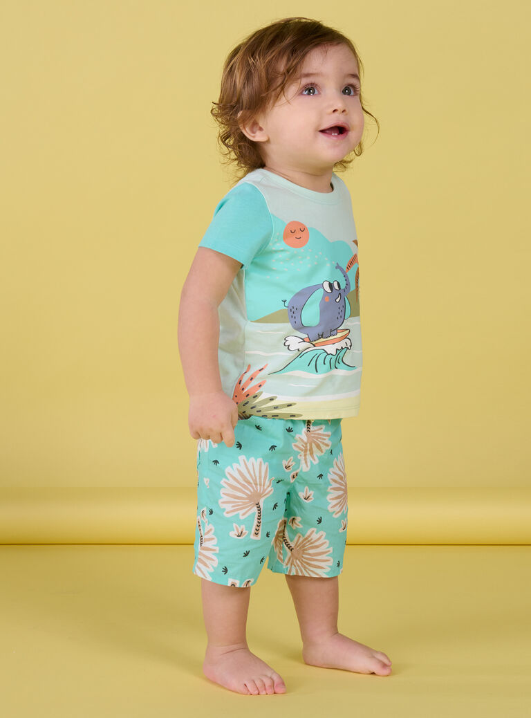 T-shirt vert d'eau à motifs éléphant surfeur et plage