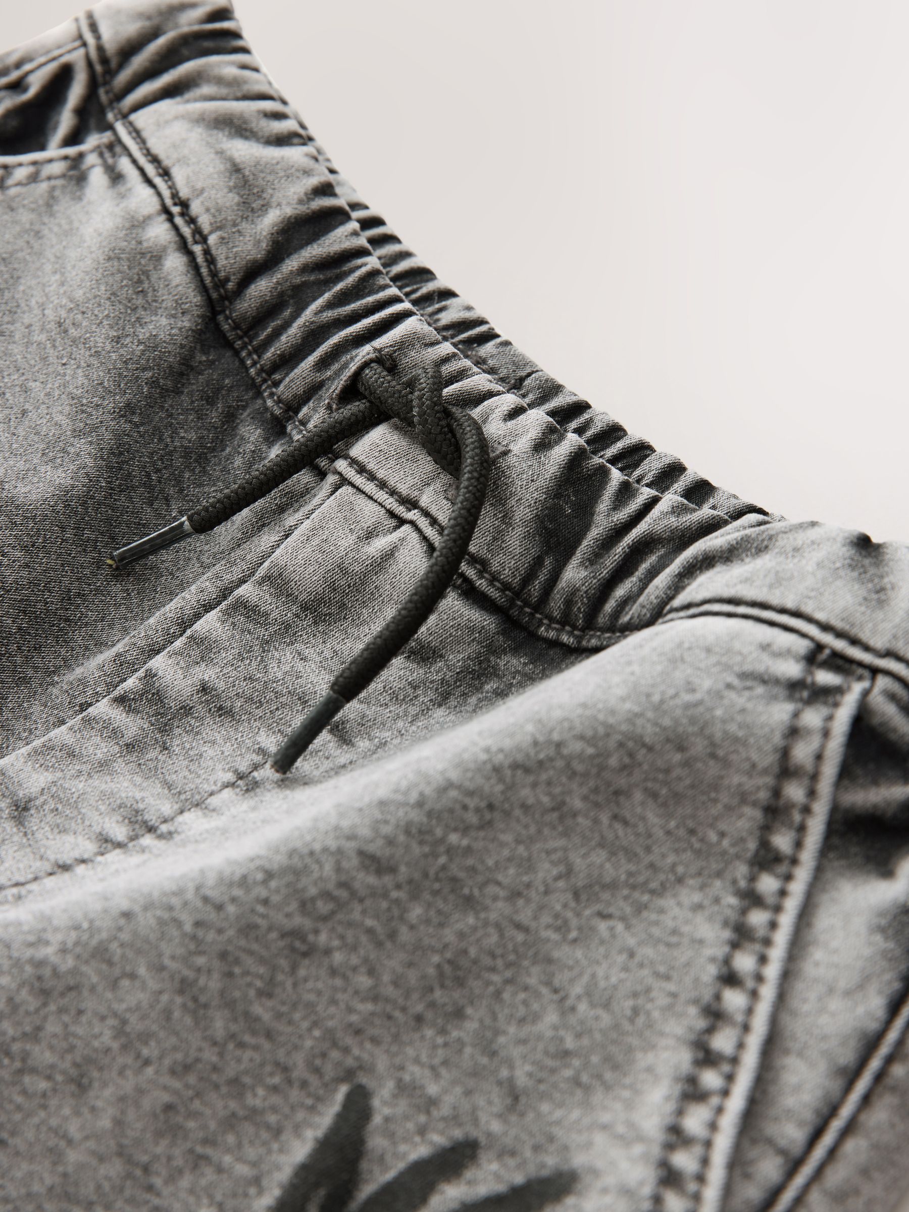 Grijs met graffiti - Cargo jeans met elastische taille (3-16 jr)