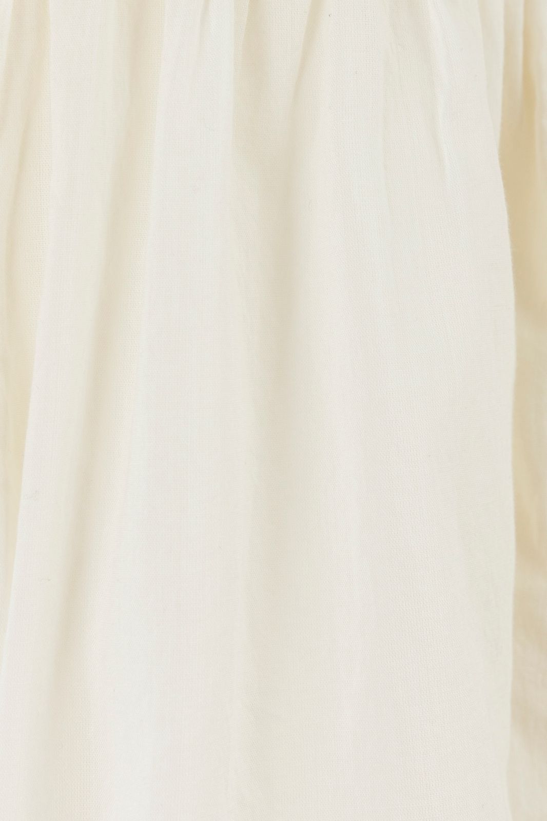 Off-white mouwloze blouse met pintuck details