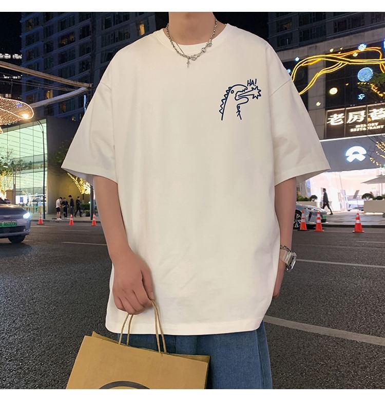 Wolfkane - Oversized T-shirt met korte mouwen, ronde hals en dinosaurusprint