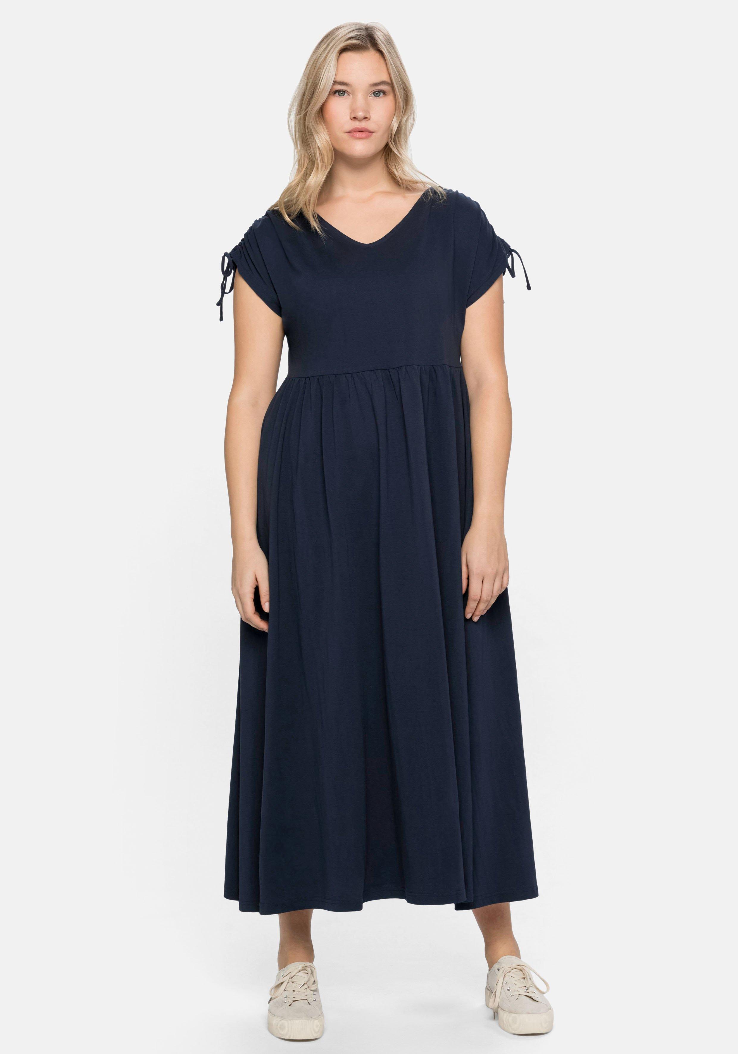 Jerseykleid mit weitem Rock und V-Ausschnitt