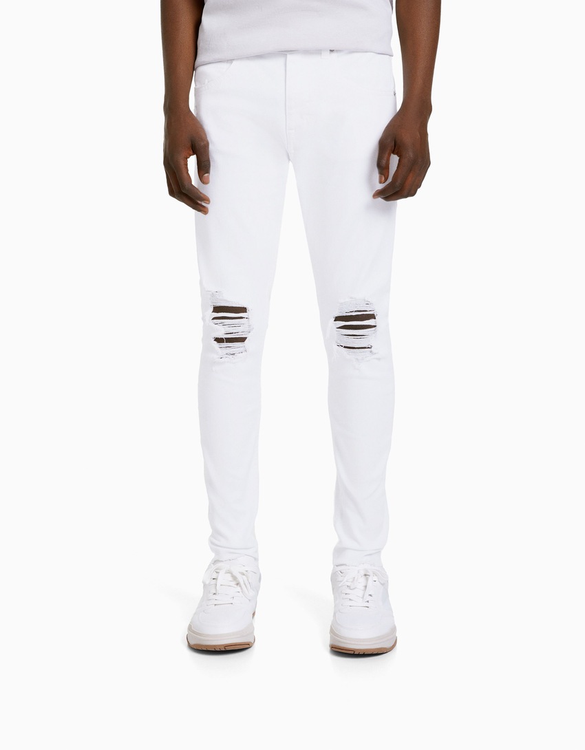calça jeans super skinny rasgada