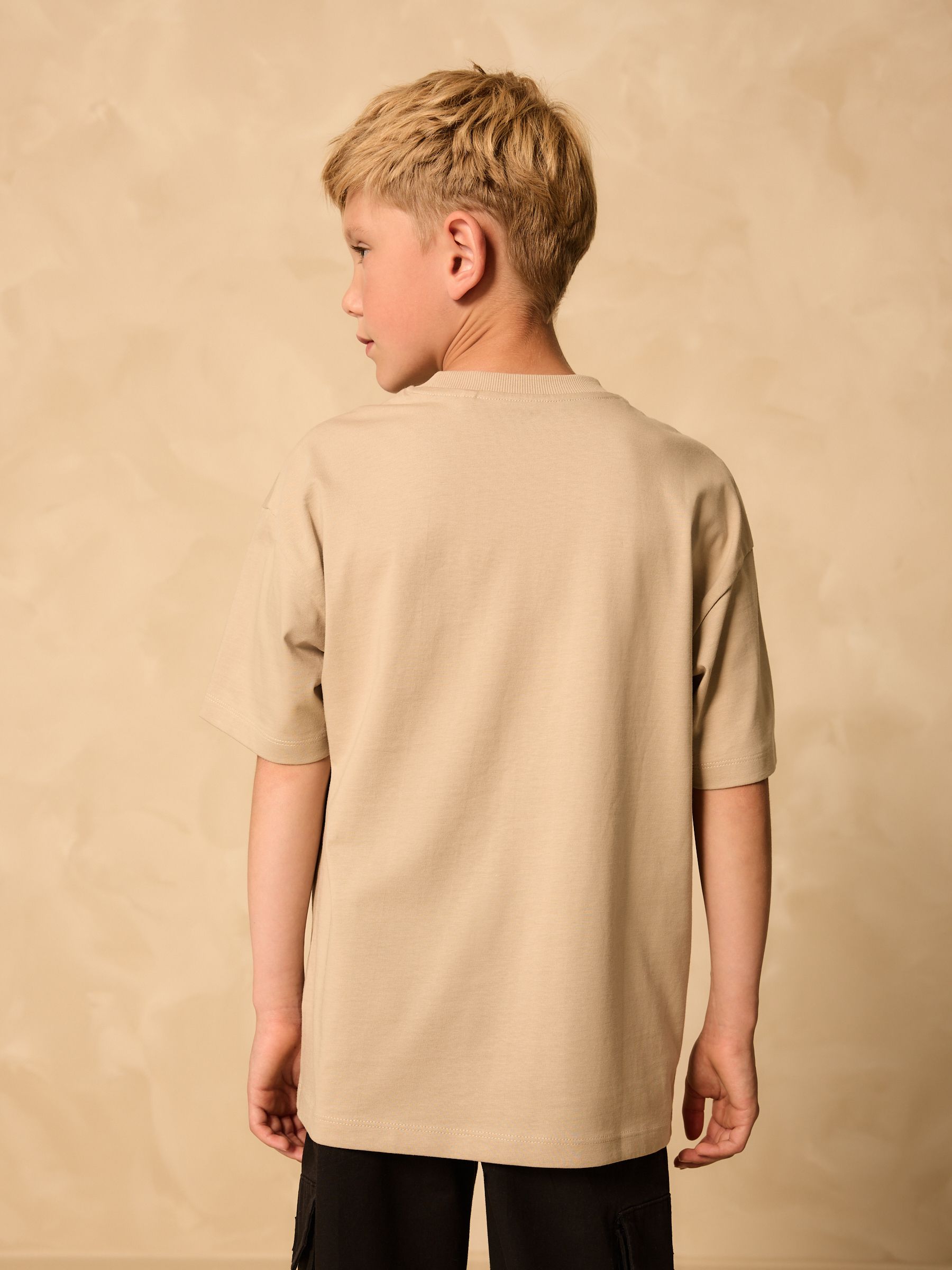 Kiezelkleurig/oranje schedel - Ruimvallend T-shirt met print en korte mouwen (3-16 jr)