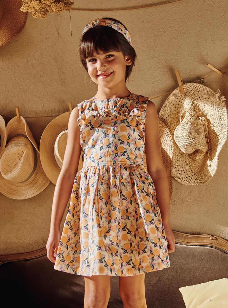Robe vanille à volants et à motif oranges