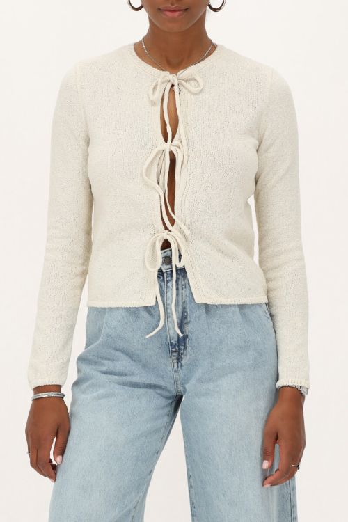 Beige vestje met strikjes