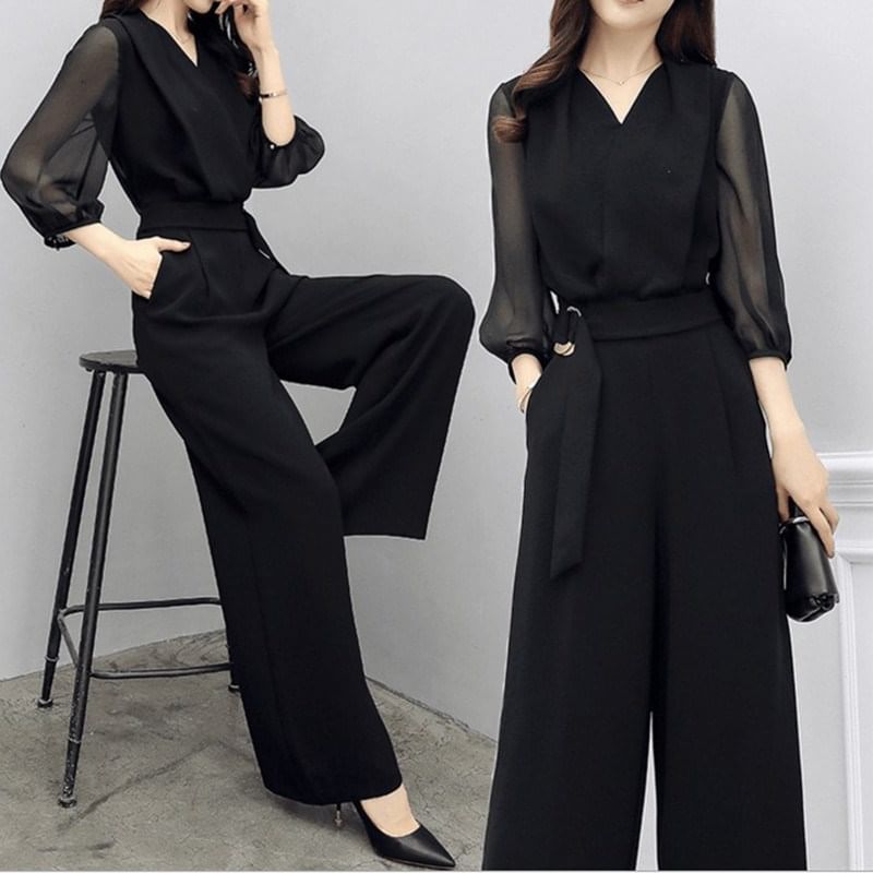 Kwuartz - Jumpsuit met pofmouwen, V-hals, effen strikceintuur en wijde pijpen