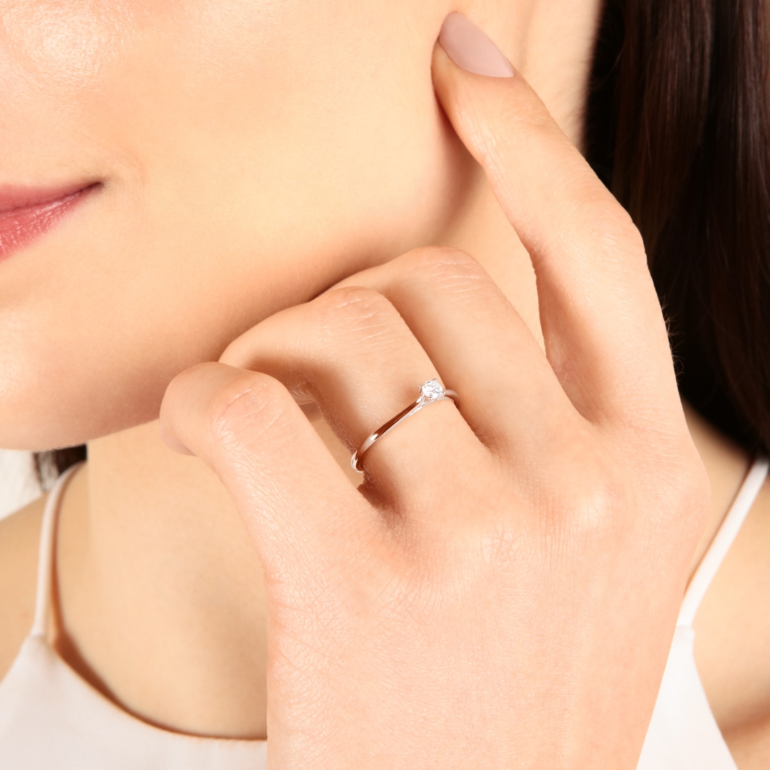 Solitärring 750/18 K Roségold mit Diamant 0.12ct H/Si
