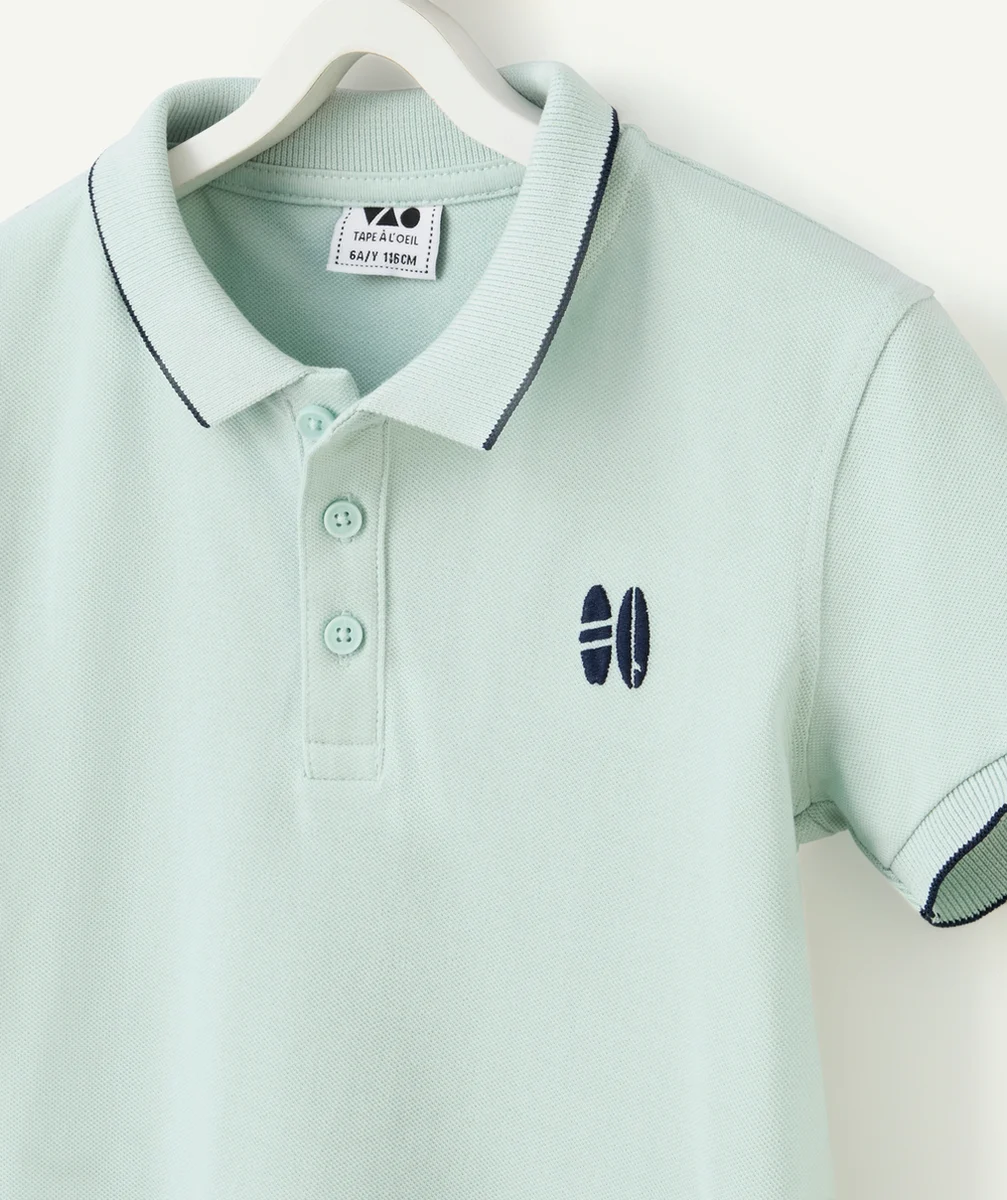 polo garçon en coton biologique bleu avec motifs surfs brodés
