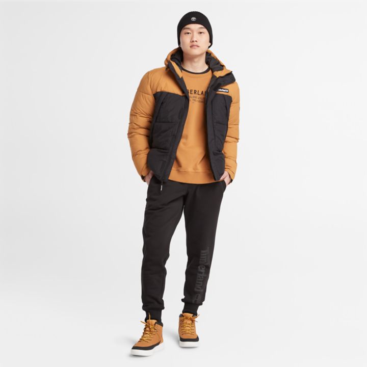 Jaqueta puffer Outdoor Archive masculina na cor amarelo escuro.