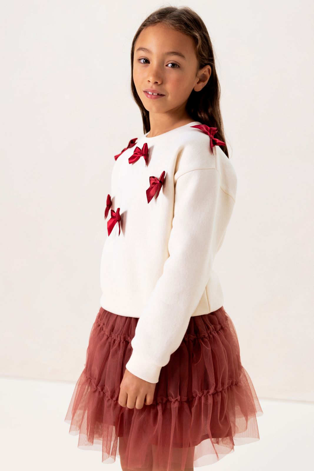 Witte sweater met strikjes