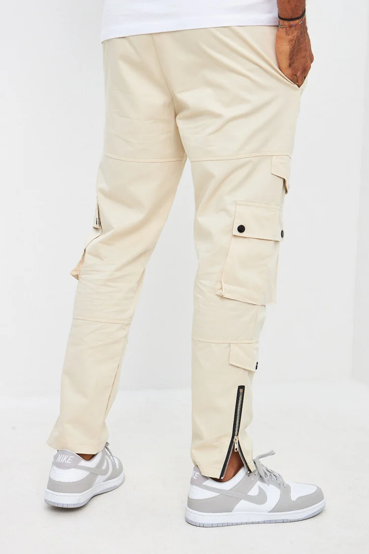Pantalon beige cargo zippé aux chevilles