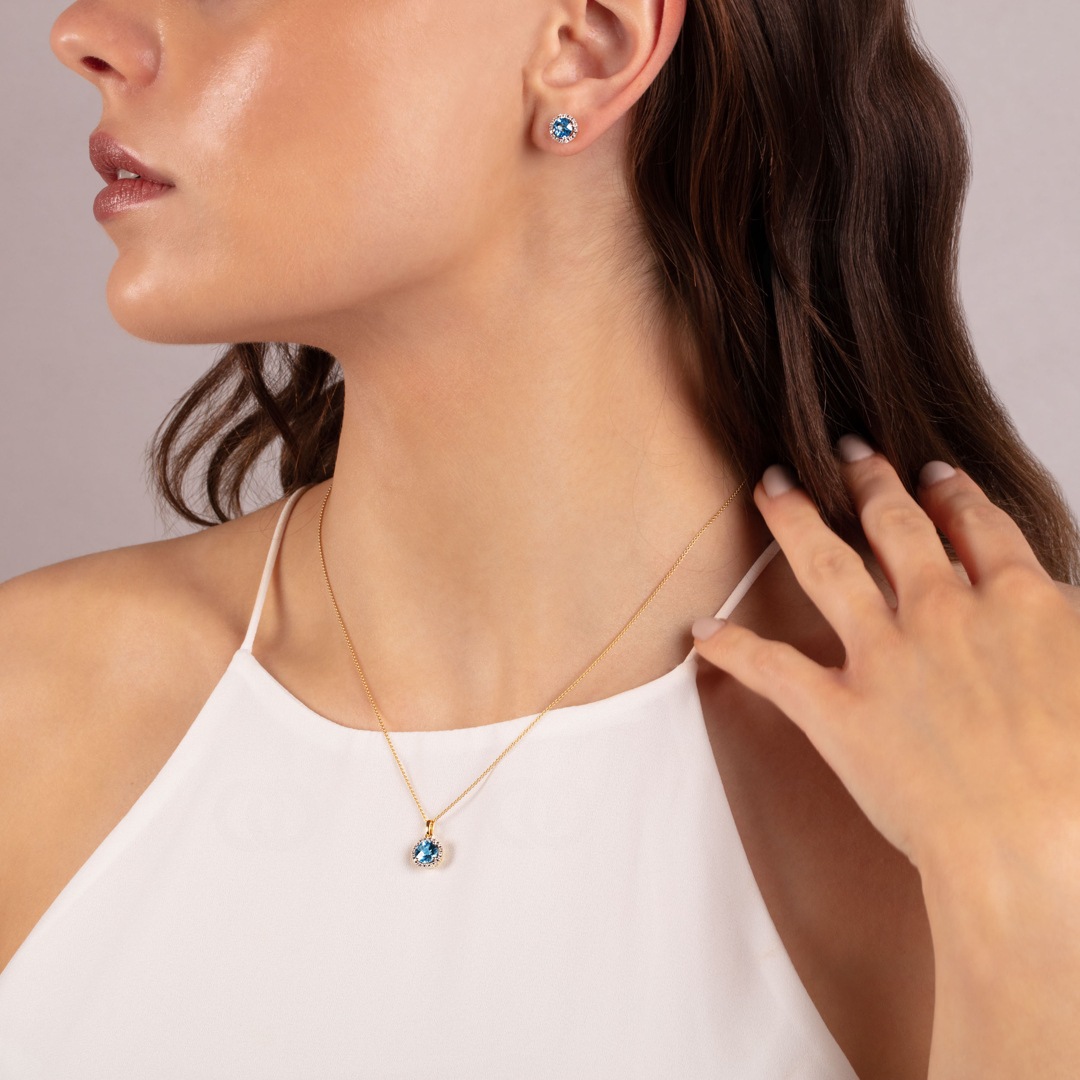 Anhänger 750/18 K Gelbgold mit Blautopas rund und Diamanten 0.05 ct H/si