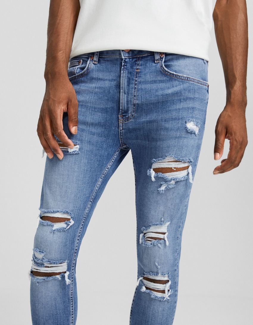 calça jeans super skinny rasgada