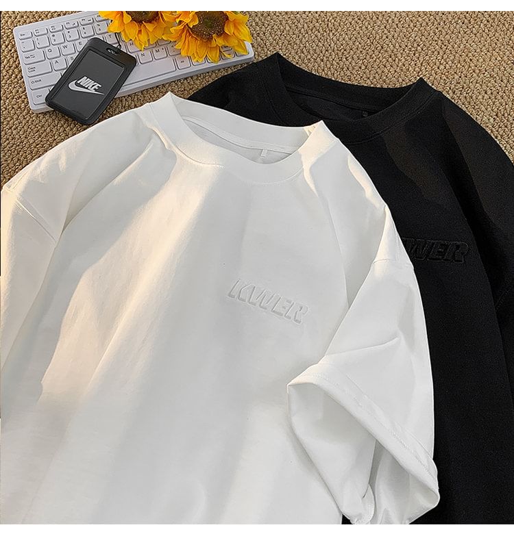 FOEV - T-shirt met ronde hals en elleboogmouwen en belettering