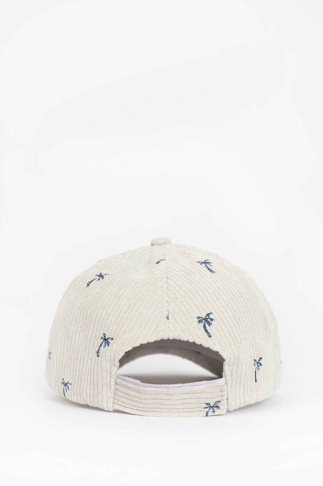 Beige corduroy pet met palmbomen