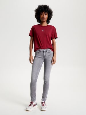 Calça jeans Scarlett de cintura baixa, corte skinny e zíper no tornozelo.