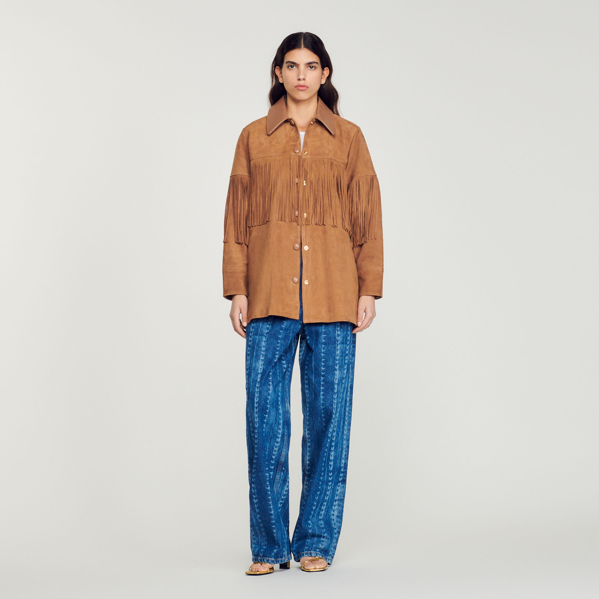Veste longue en cuir á franges