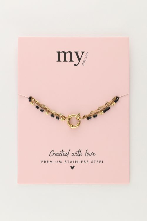 Driedubbele armband met zwarte kralen