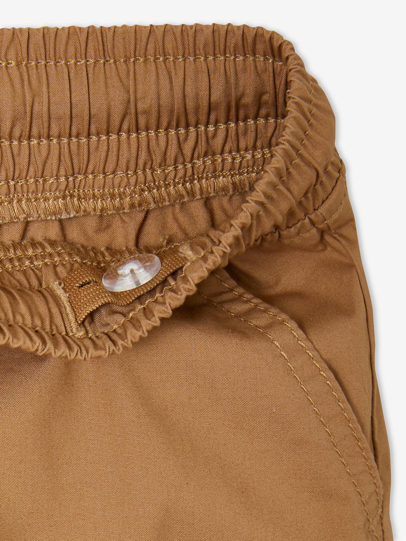 Bermudas fáceis de vestir para meninos, lisas em azul escuro com estampas.