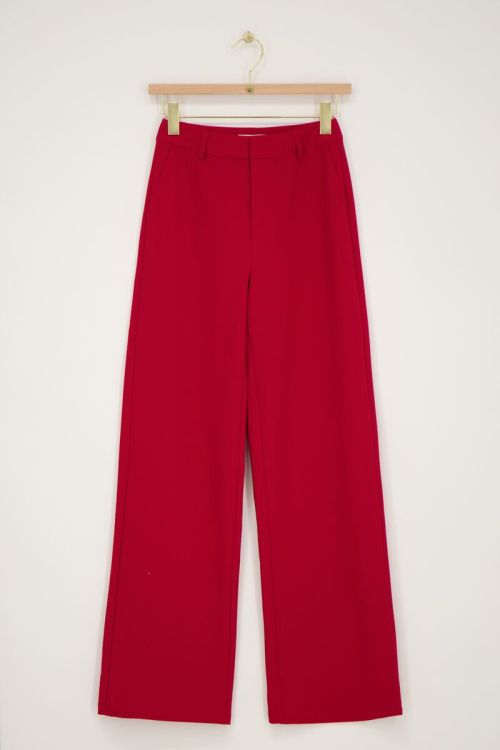 Rode pantalon met blinde knoop