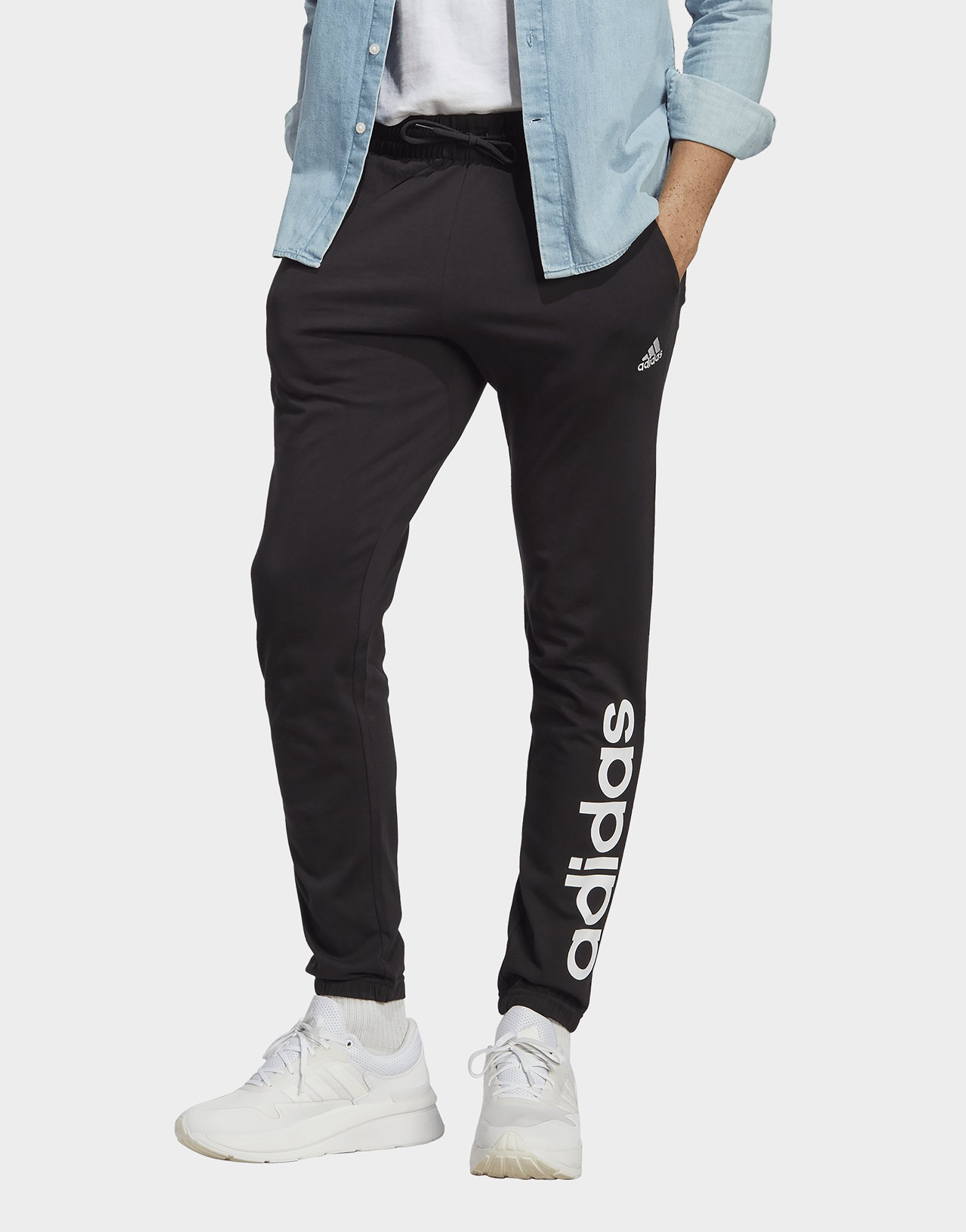 adidas Pantalon fuselé élastique en jersey avec logo Essentials