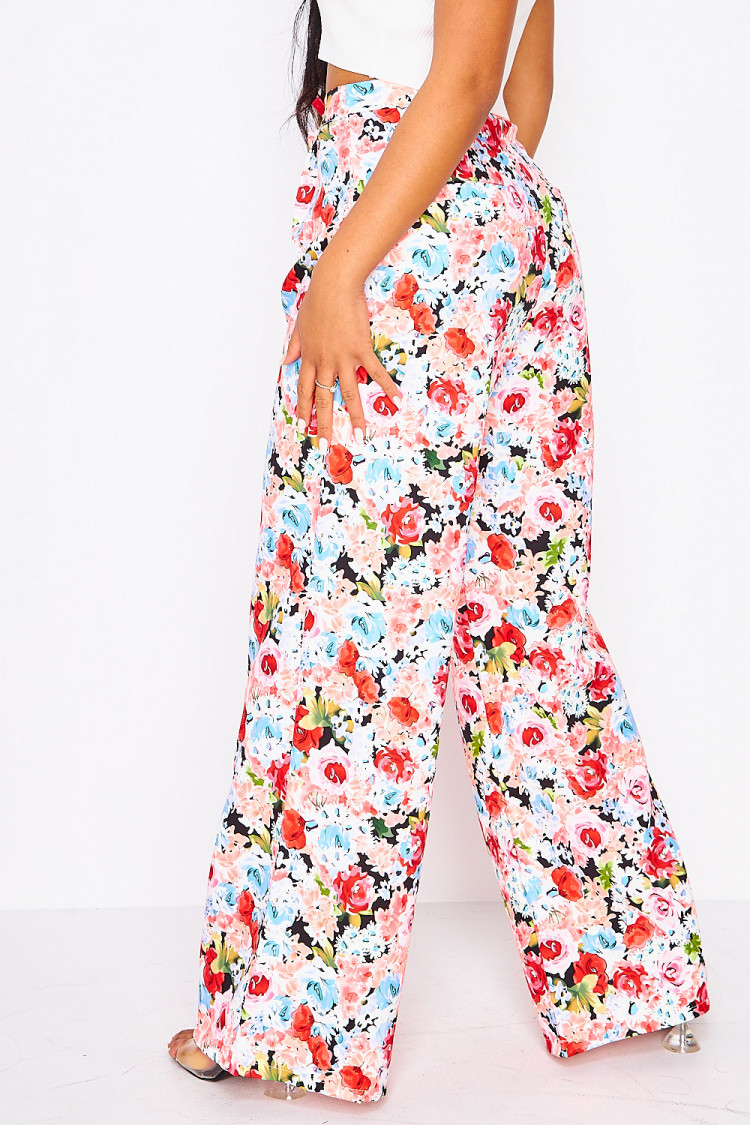Pantalon à pinces rose imprimé fleuri