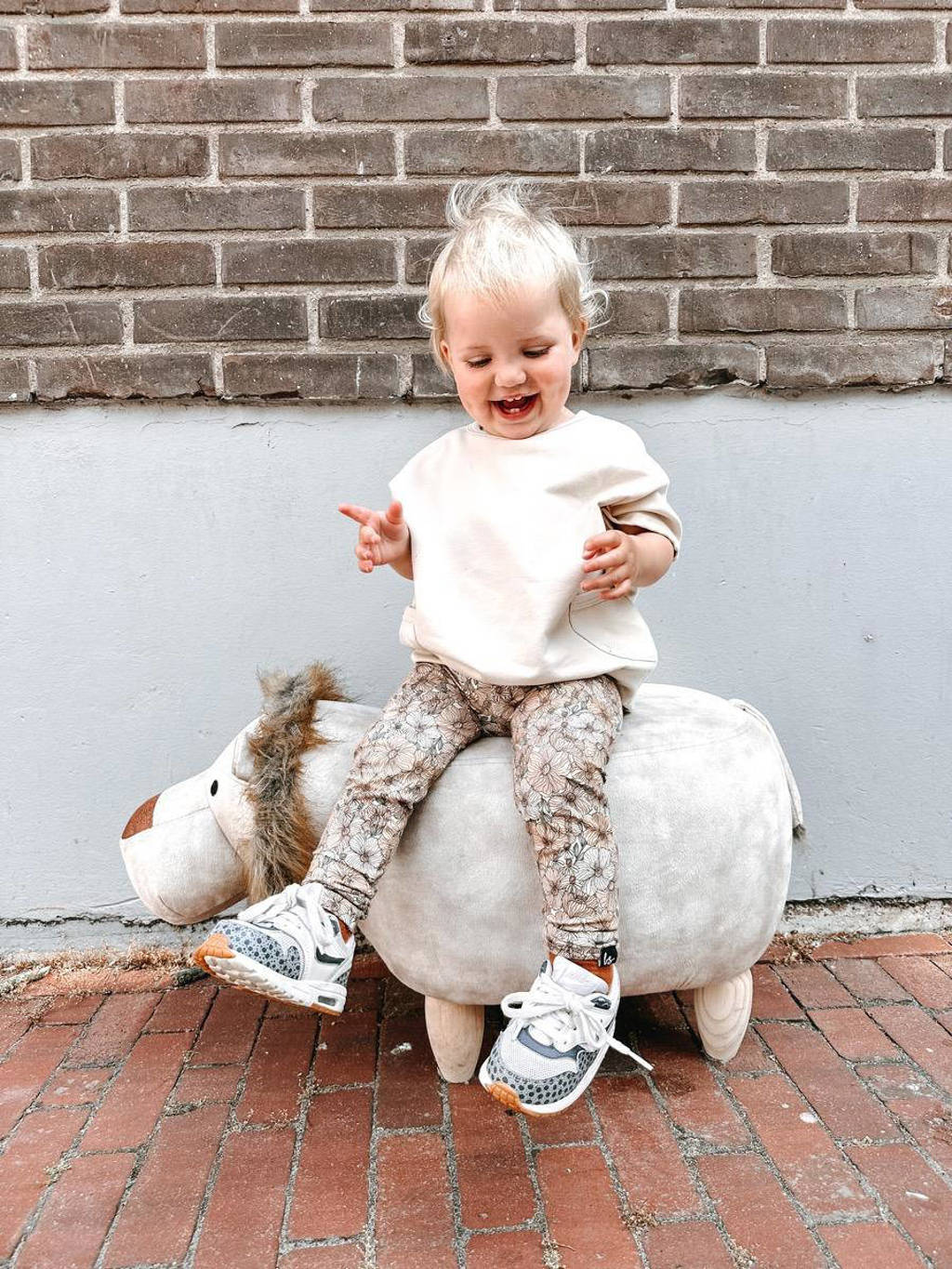 Babystyling baby gebloemde legging roze/zachtoranje