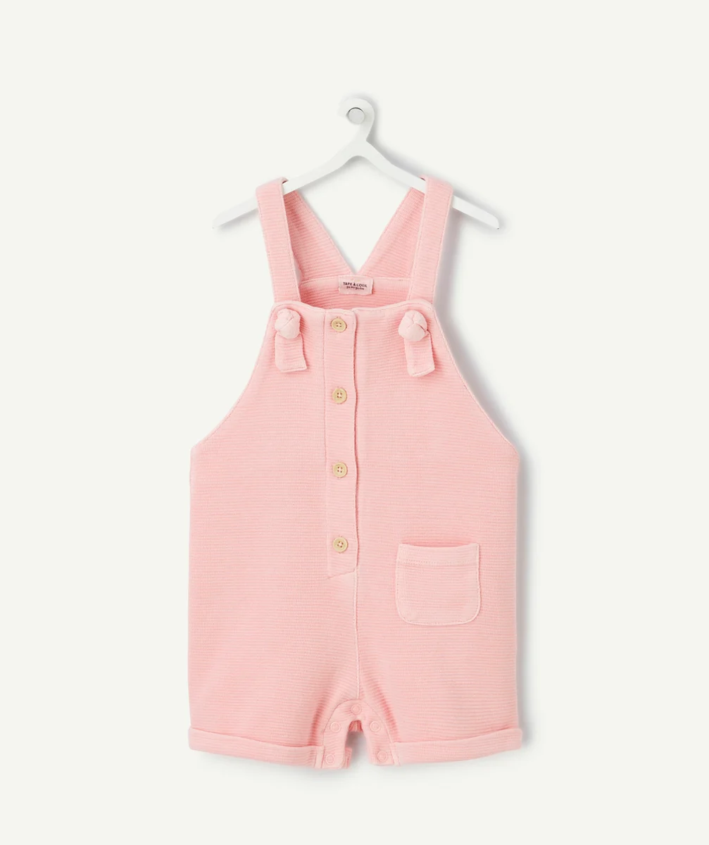 salopette bébé fille rose en nid d'abeilles avec noeuds
