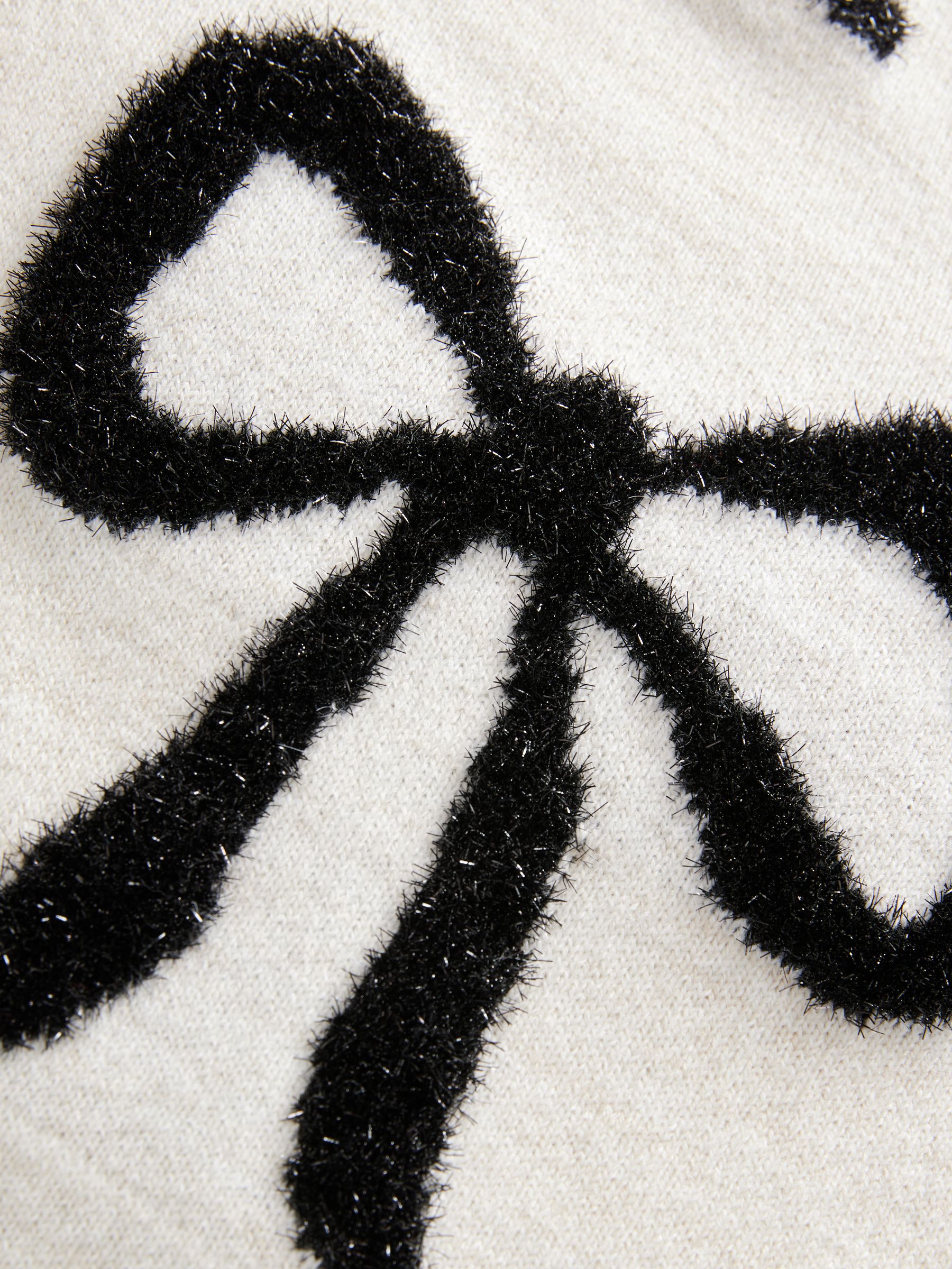 Witte en zwarte strik van metallic garen - Gebreide kersttrui
