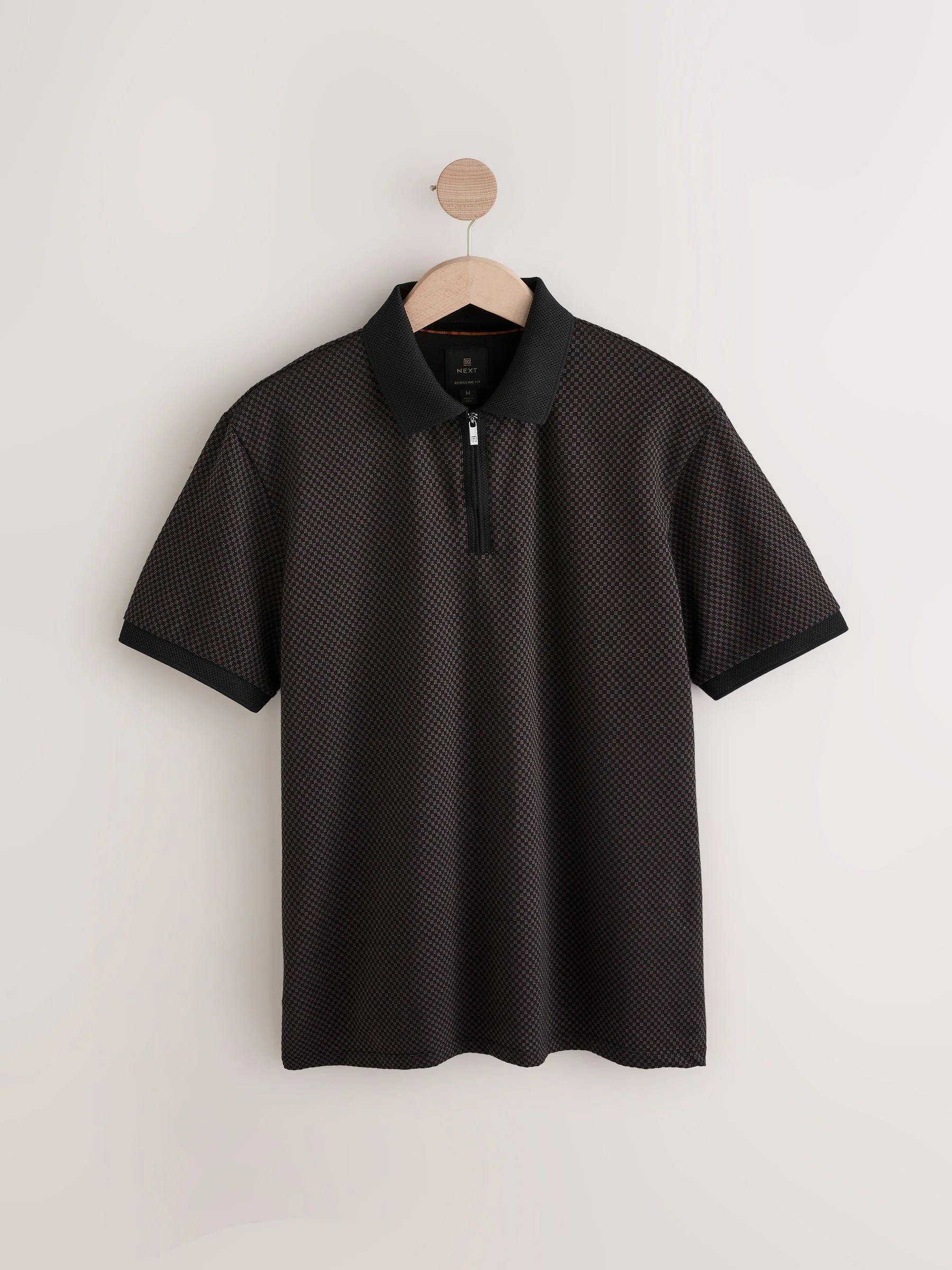 Zwart met goud - Modieus poloshirt met kwartrits