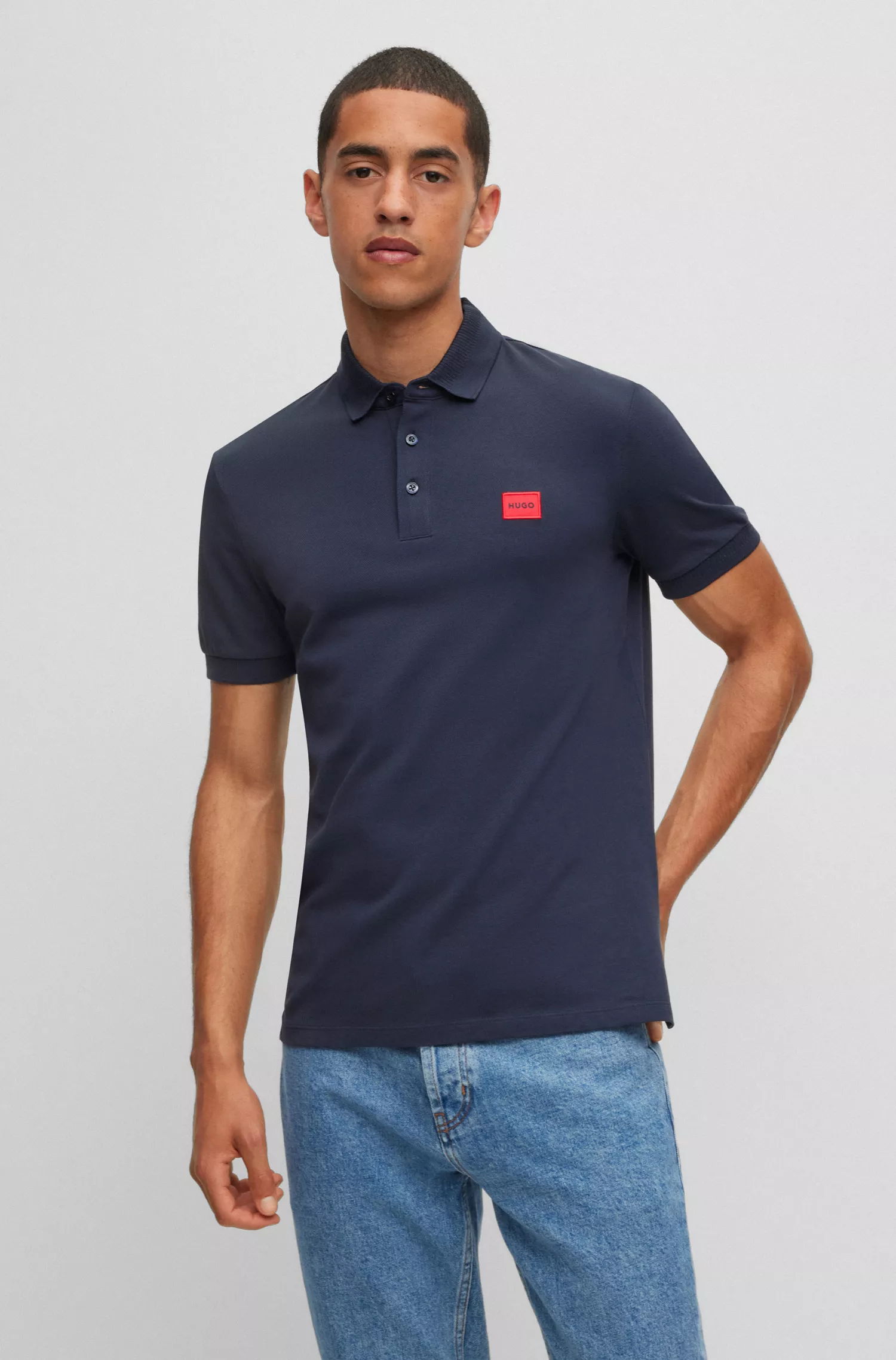 Camisa polo HUGO vermelha em piqué de algodão com corte slim e etiqueta com o logotipo.