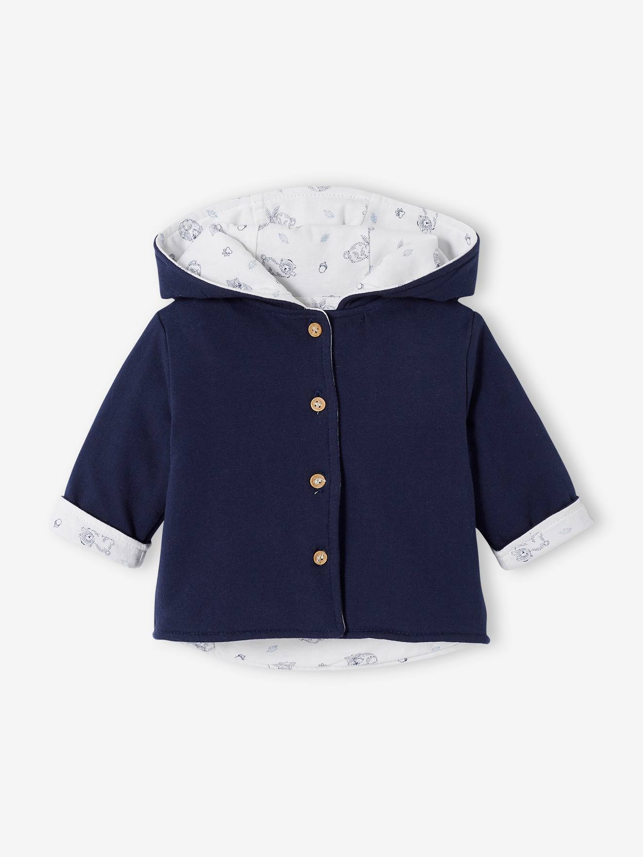 Jaqueta reversível com capuz para bebê, azul-marinho lisa com estampas.