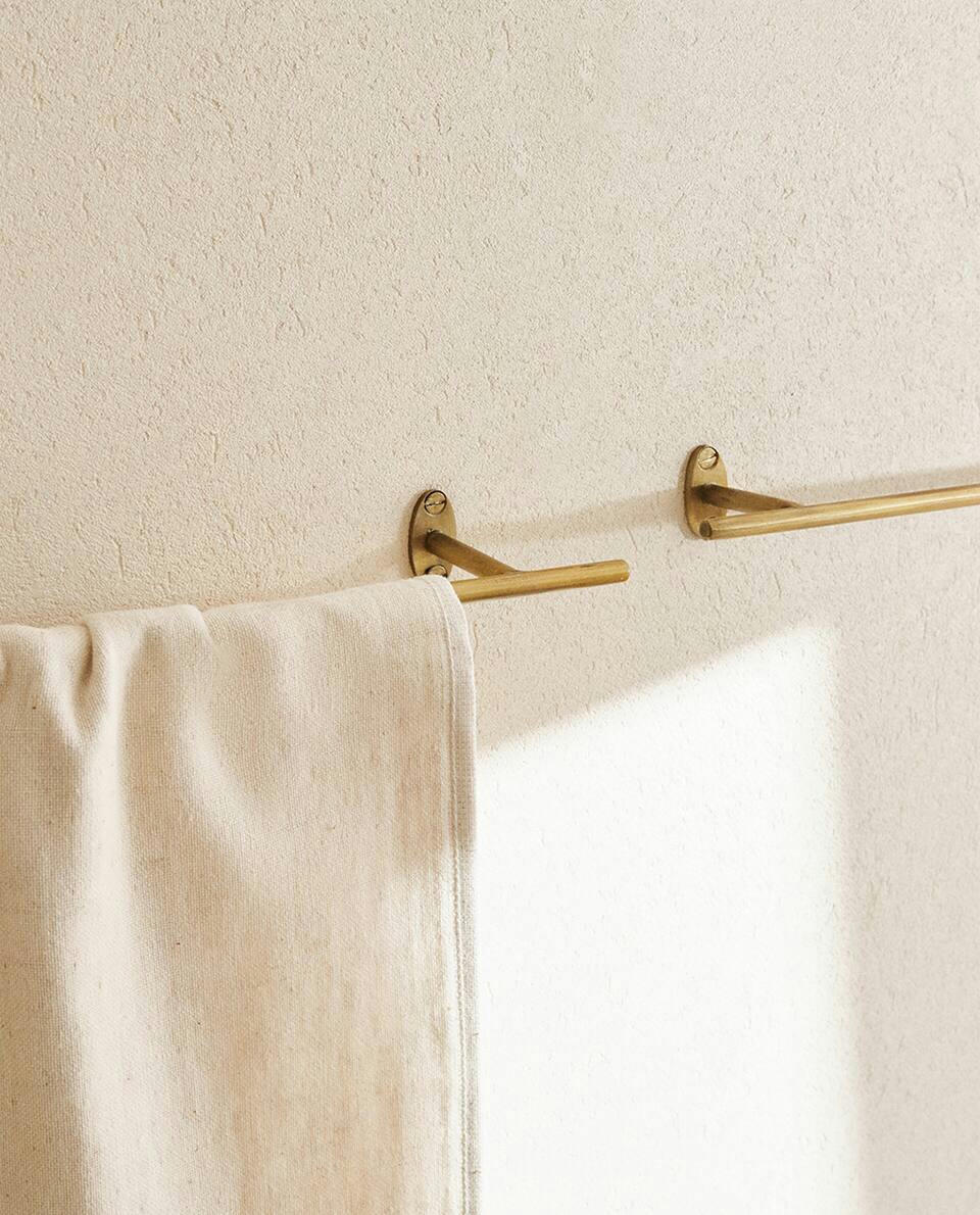 SUPORTE DE TOALHAS EM AÇO DOURADO