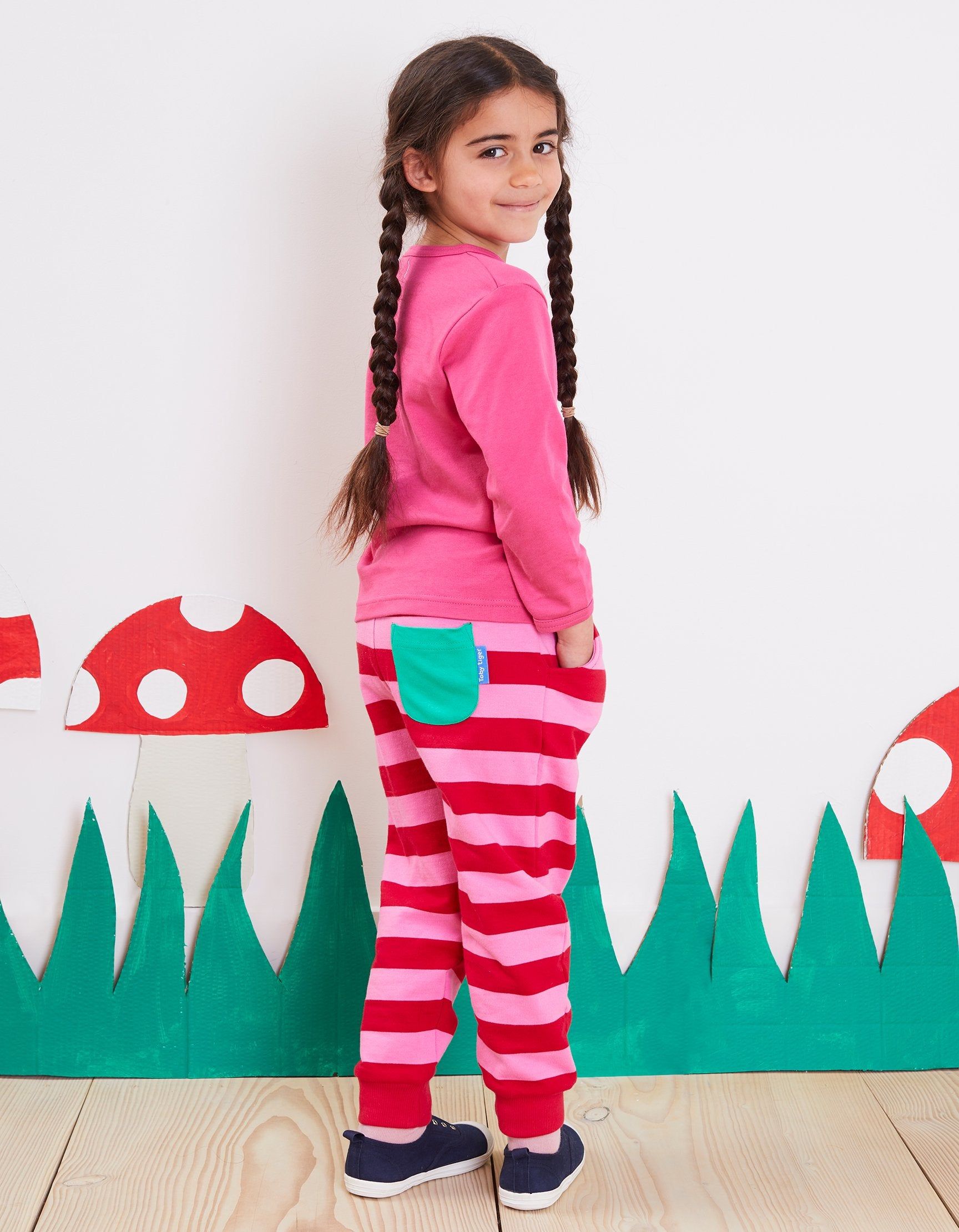 Toby Tiger Gestreifte Babyhose , pink und rot gestreift