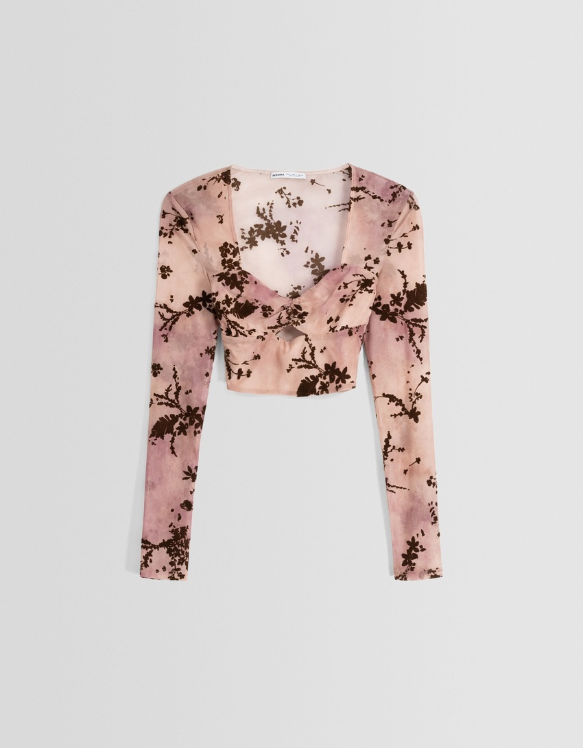 Camiseta de tule de manga comprida com estampa floral.