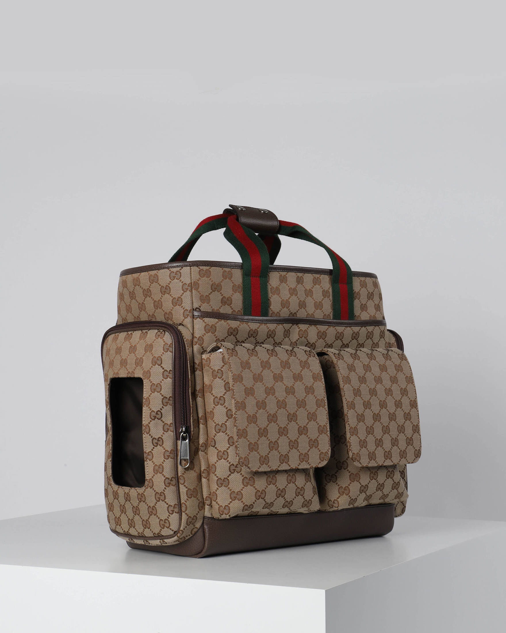 Gucci| Wickeltasche aus PARENT'S B. GG CANVAS mit Leder