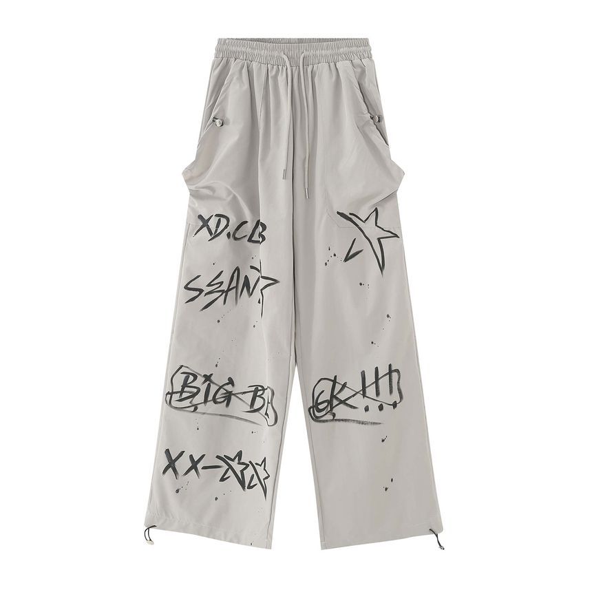 FAERIS - Rechte trainingsbroek met trekkoord en graffitiprint