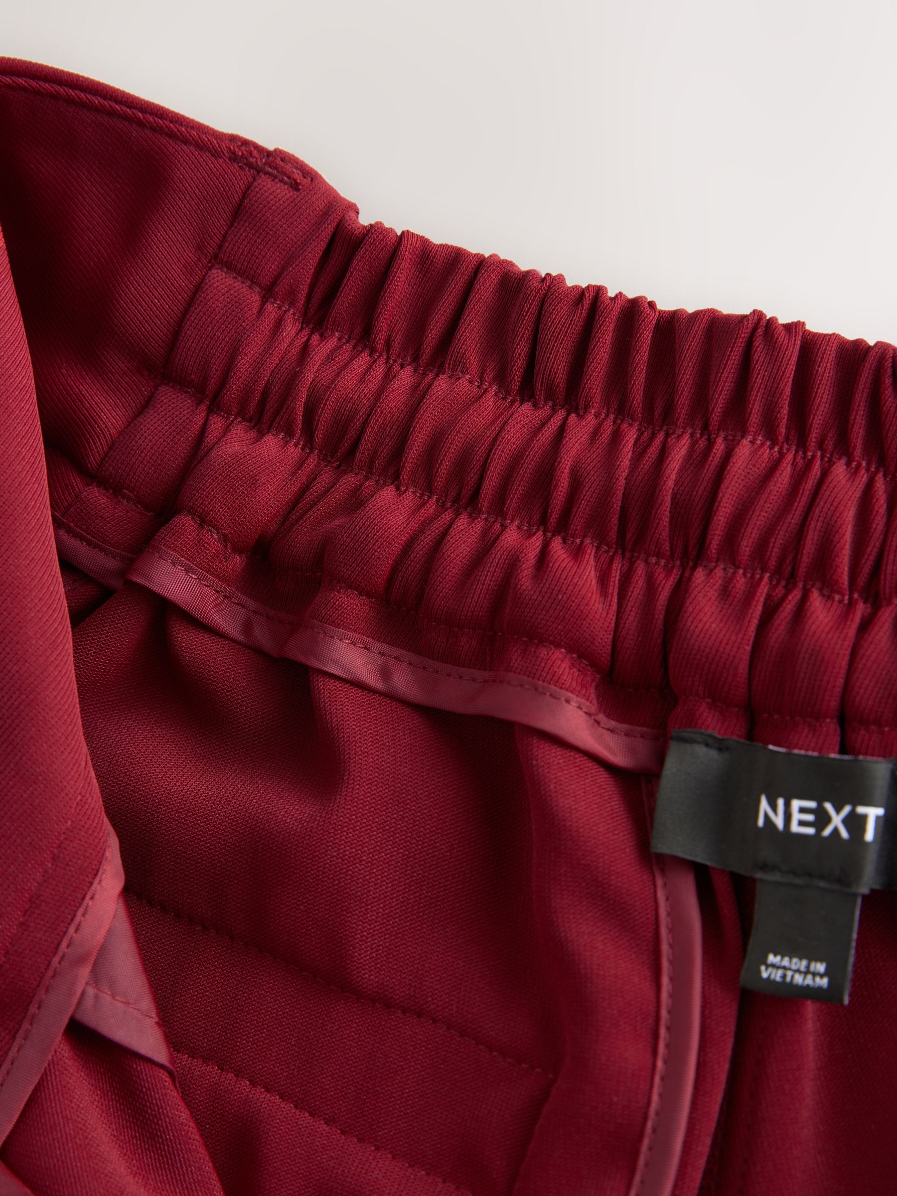 Rood - Broek met wijde pijpen en elastiek in de achterkant