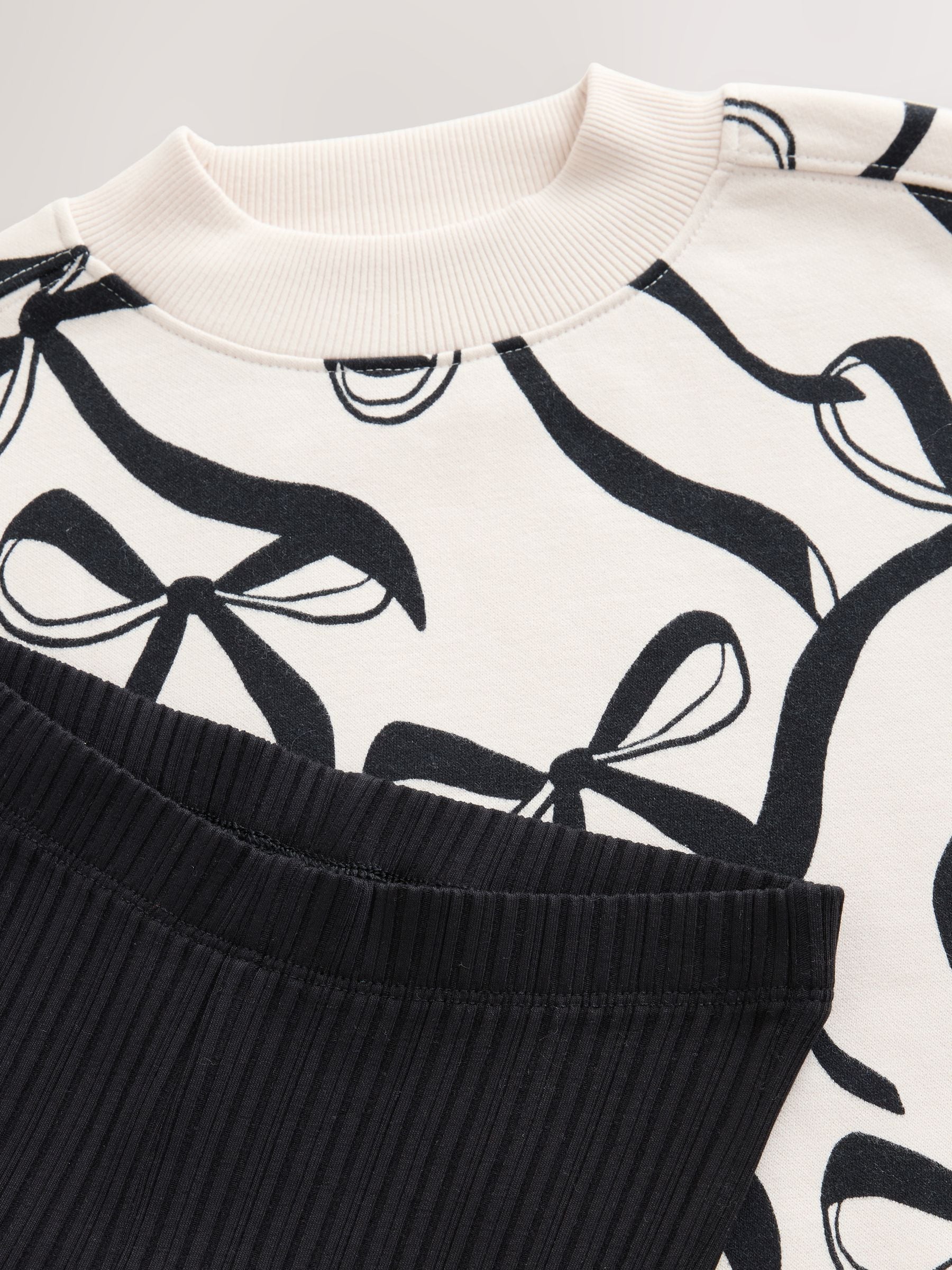 Crème strik/Zwart - Set van sweatshirt en geribbelde flared broek (3-16jr)
