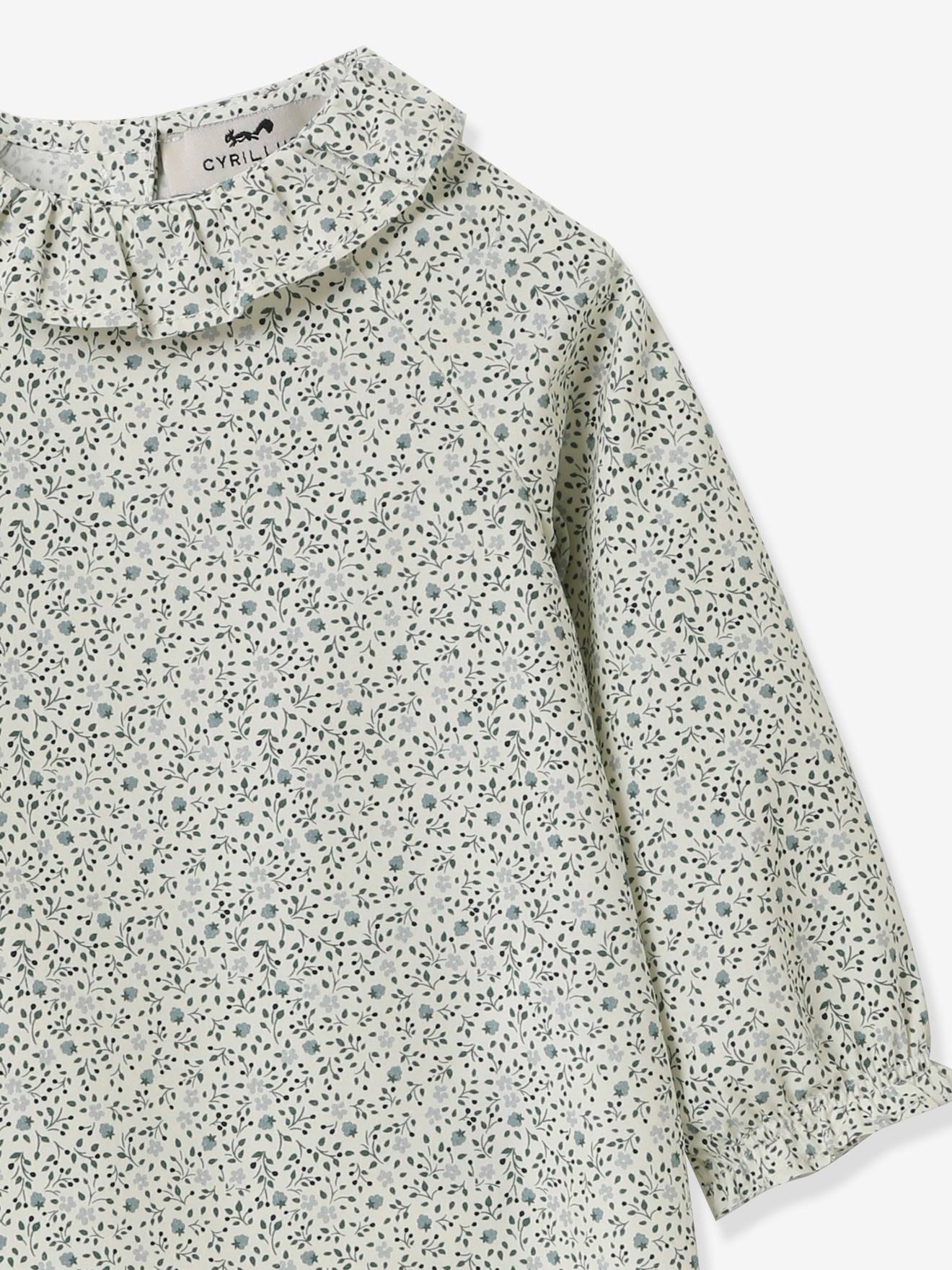 Blusa infantil CYRILLUS com estampa floral azul.